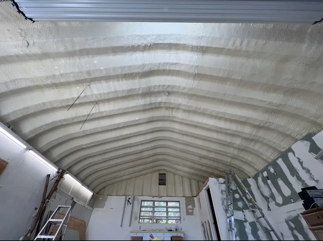 Spray polyurethane foam applied to the underside of a metal roof deck in Issaquah